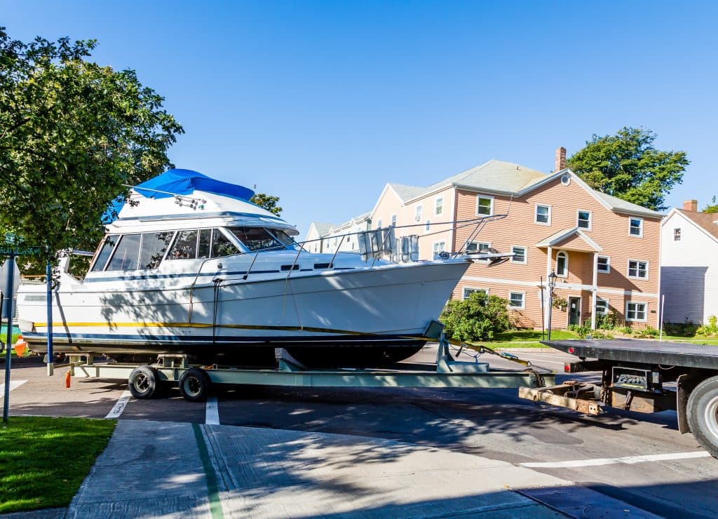 Boat on trailer being shipped across Canada